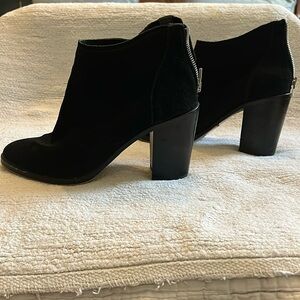 Dolce Vita black suede boots with block heels.
